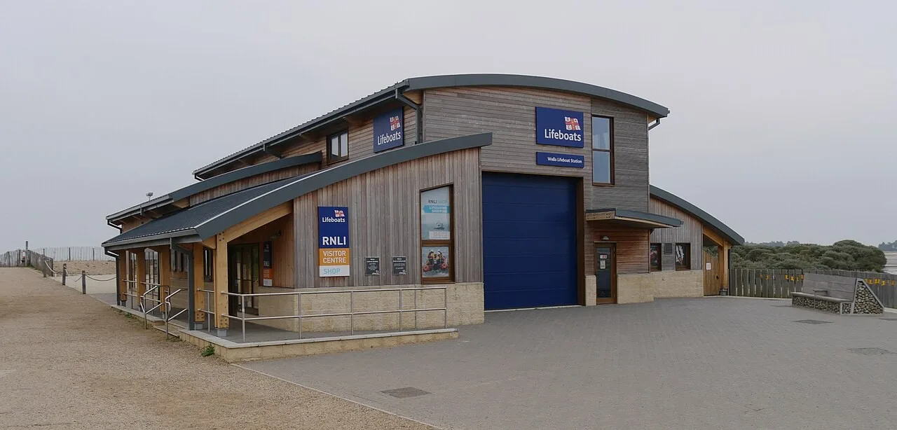 The modern Wells Lifeboat Station beside the harbour entrance