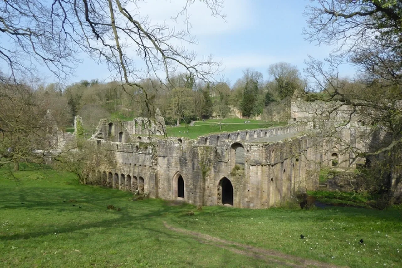 Stone arches and walls of Fountains Abbey ruins near Ripon