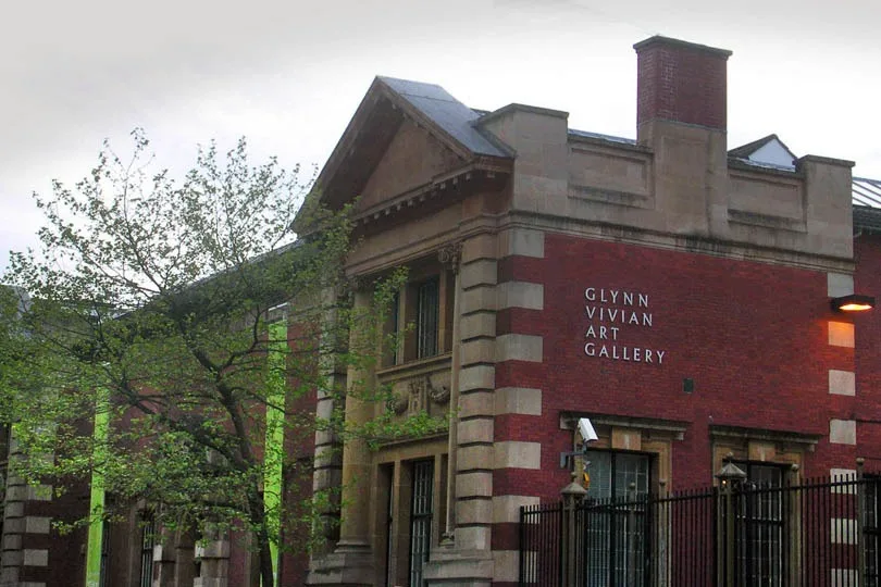 Red-brick and stone corner of Glynn Vivian Art Gallery with its name on the wall