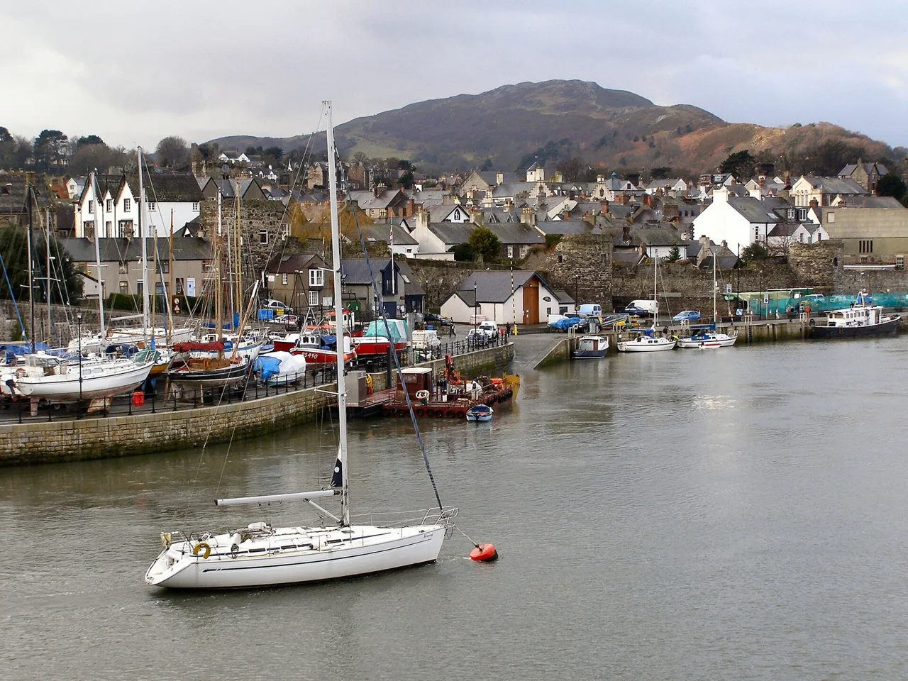 Boats beside Conwy Quay and the waterfront buildings
