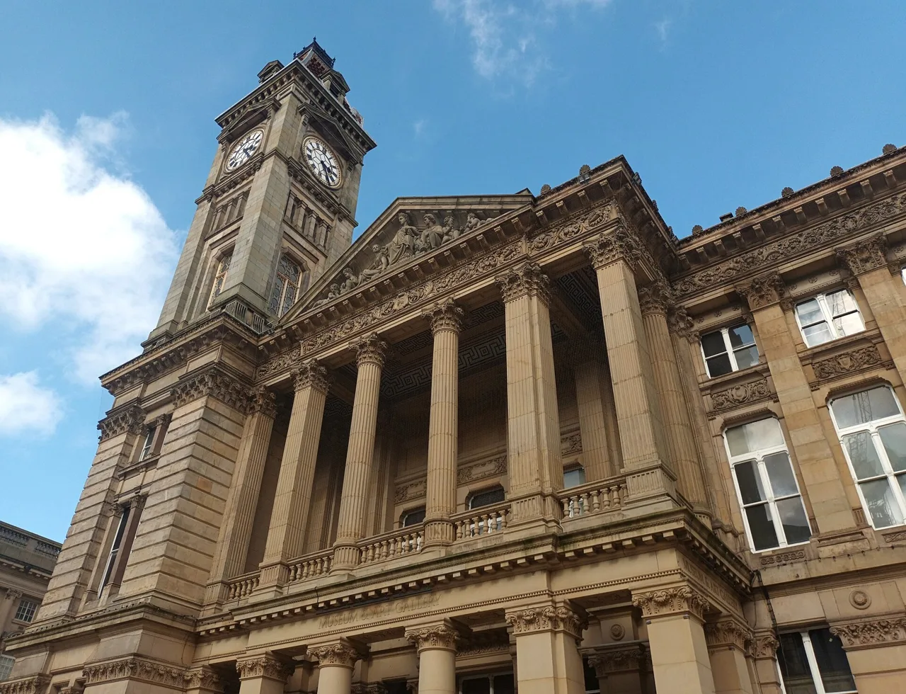 Columns, carved stonework and clock tower on Birmingham Museum and Art Gallery