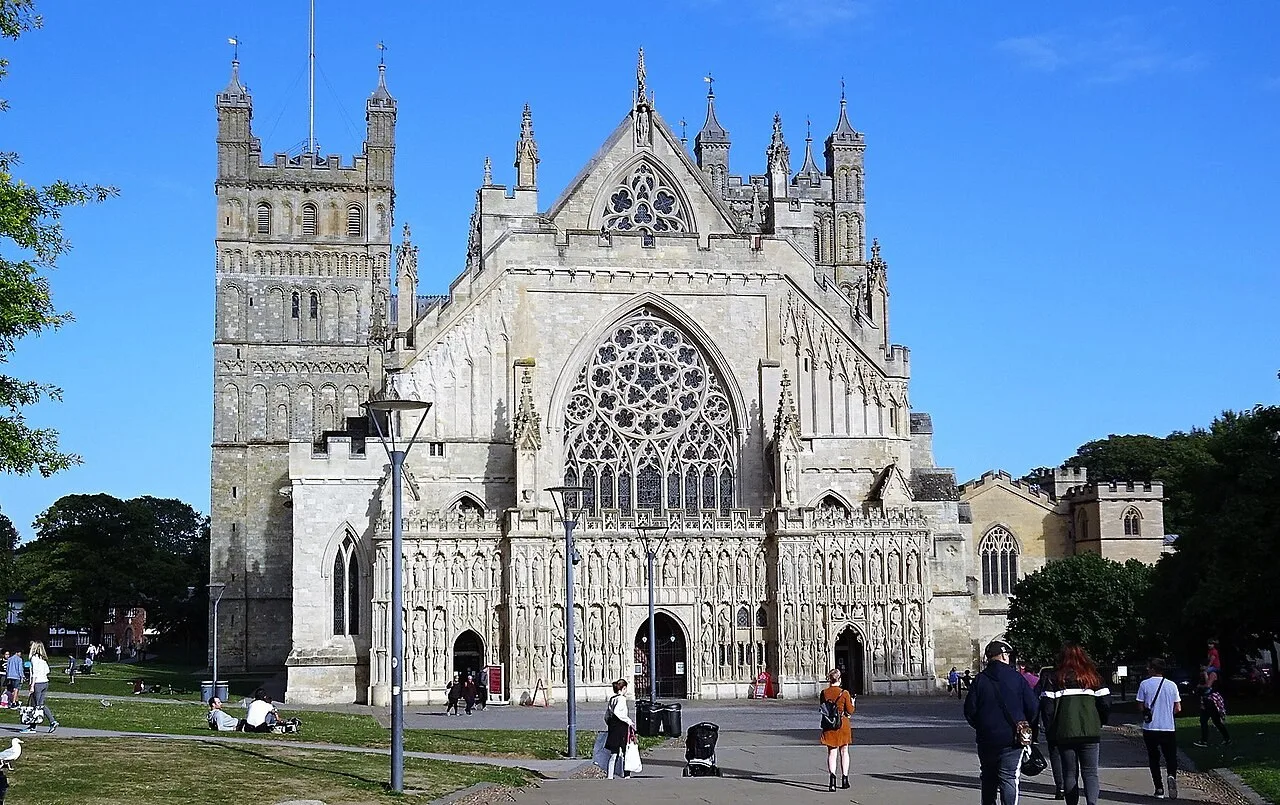 Exeter Cathedral’s sculpted west front beyond Cathedral Green