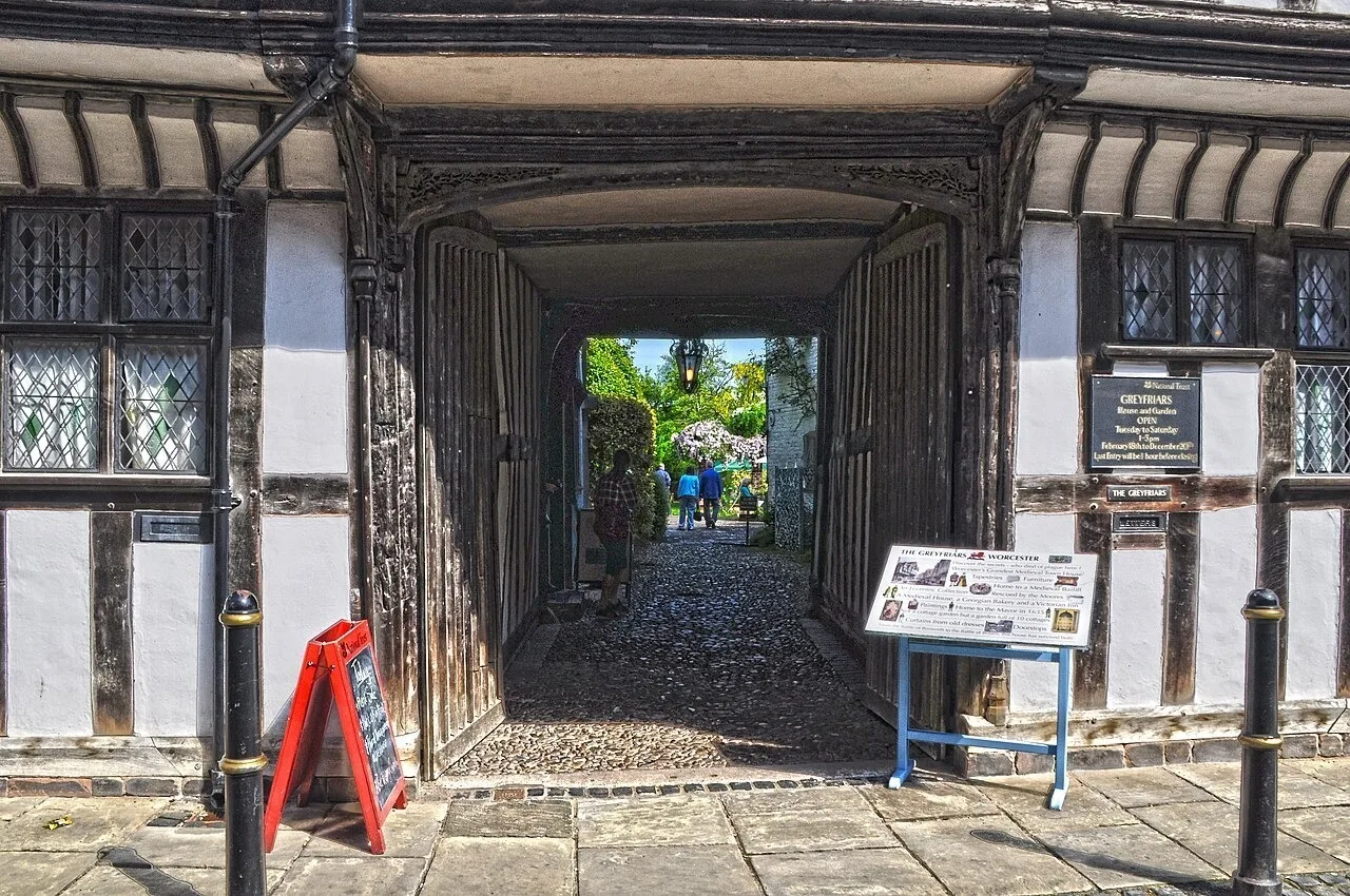 Timber-framed passage through Greyfriars House towards its garden
