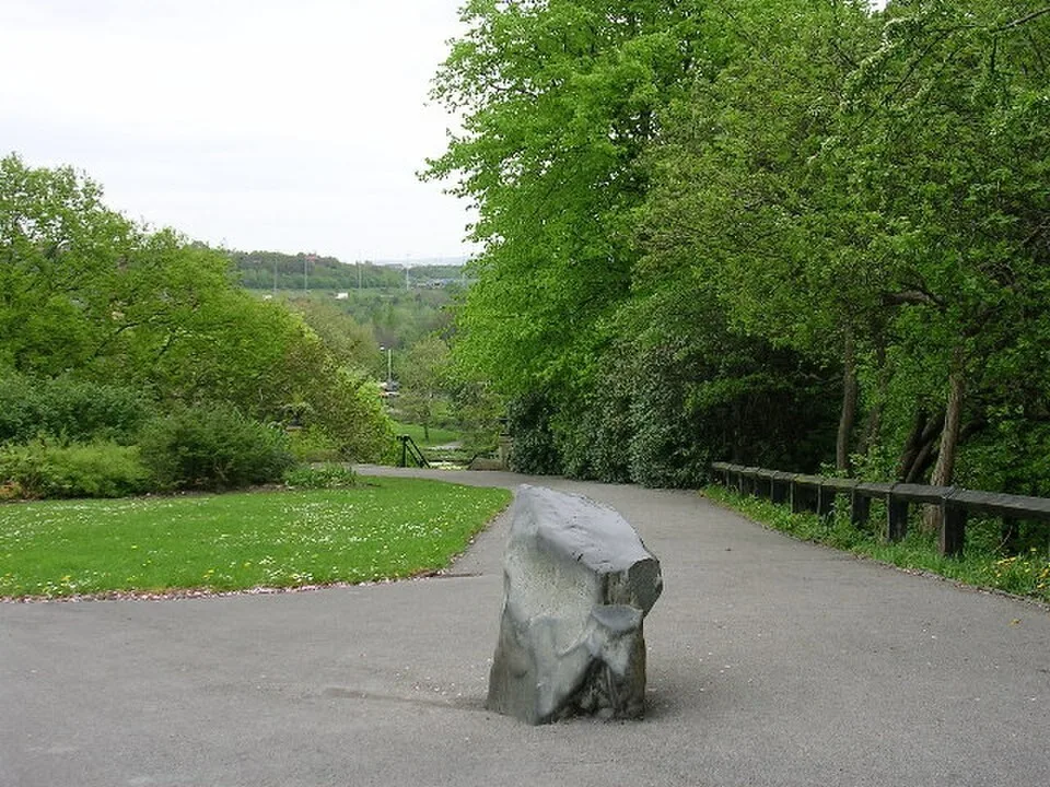 A glacial boulder and planting in Vernon Park, Stockport