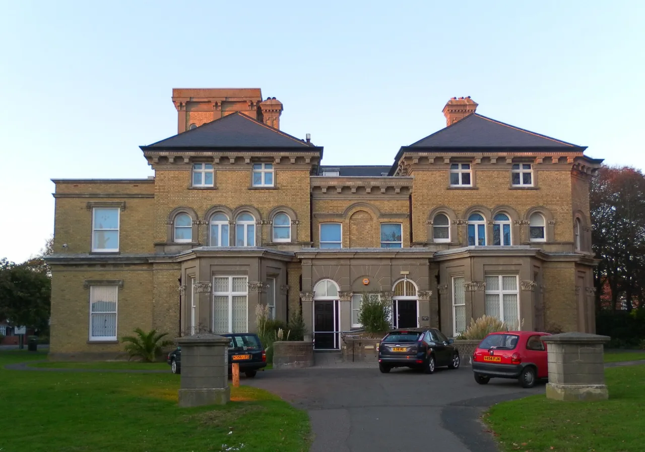The brick façade of Hove Museum of Creativity in its garden setting