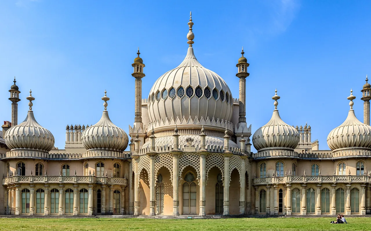 The domes and ornate façade of Brighton’s Royal Pavilion above a lawn