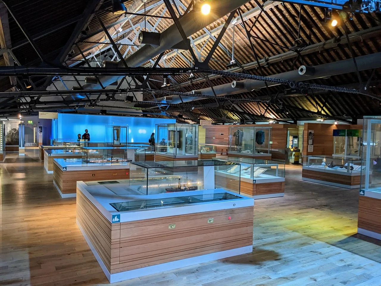 Display cases beneath the historic roof inside the National Waterfront Museum