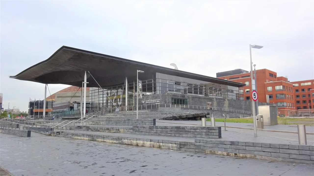 The Senedd’s broad roof and glazed public frontage viewed from the east