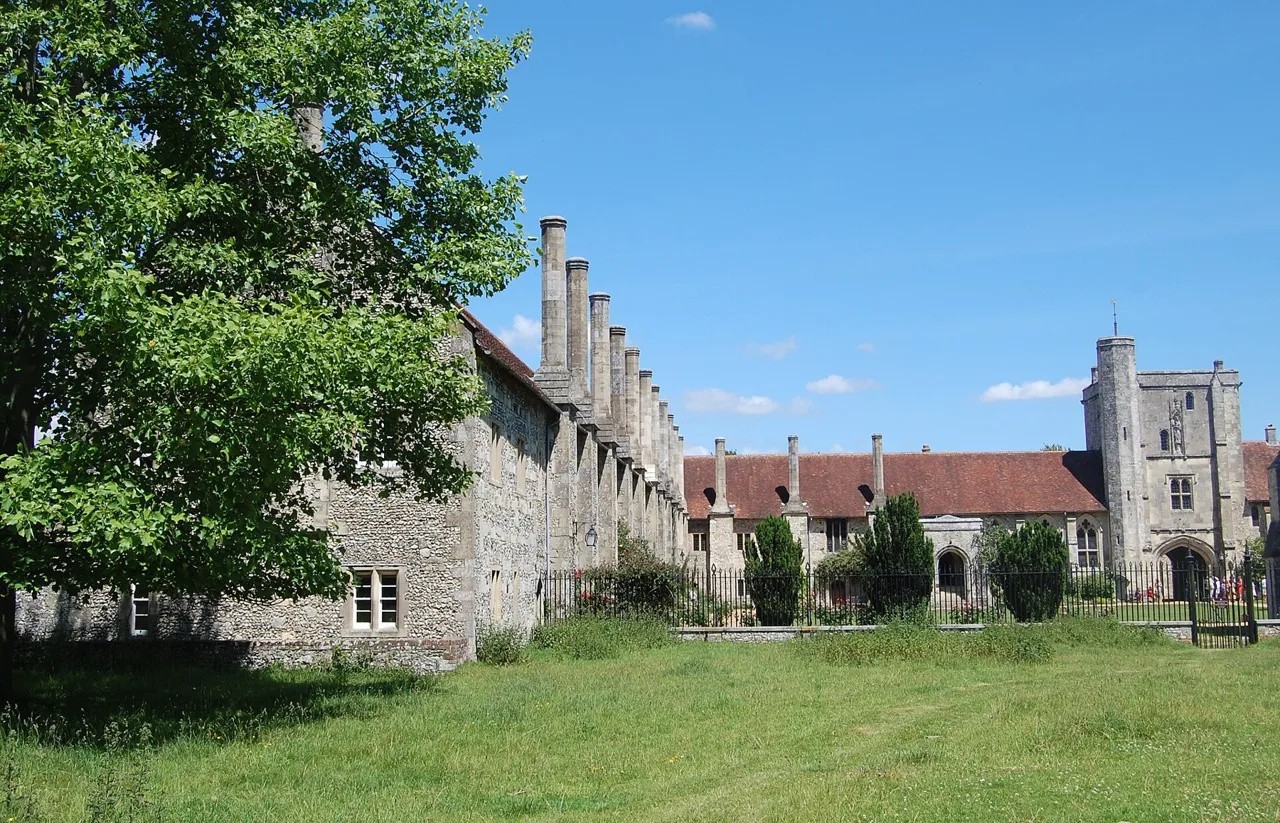 The lawn and historic buildings in the quadrangle of the Hospital of St Cross