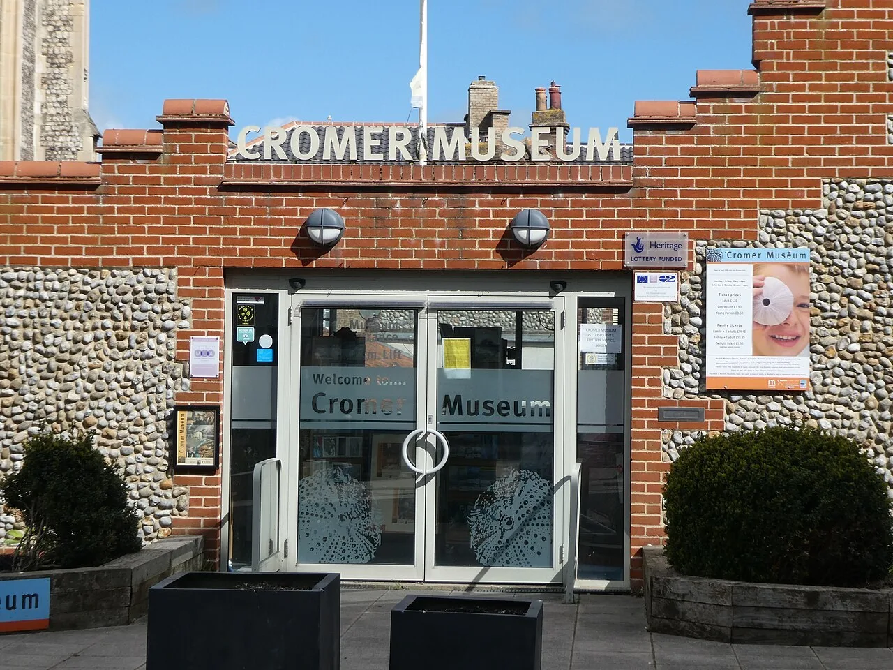 Signed entrance to Cromer Museum beside the parish church