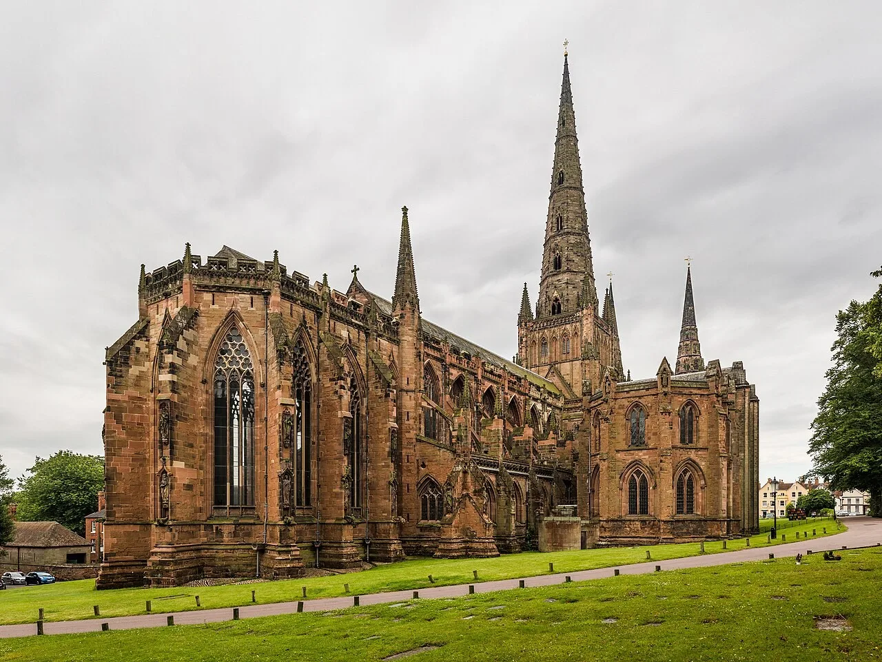 Carved sandstone exterior and three spires of Lichfield Cathedral viewed from the north-east