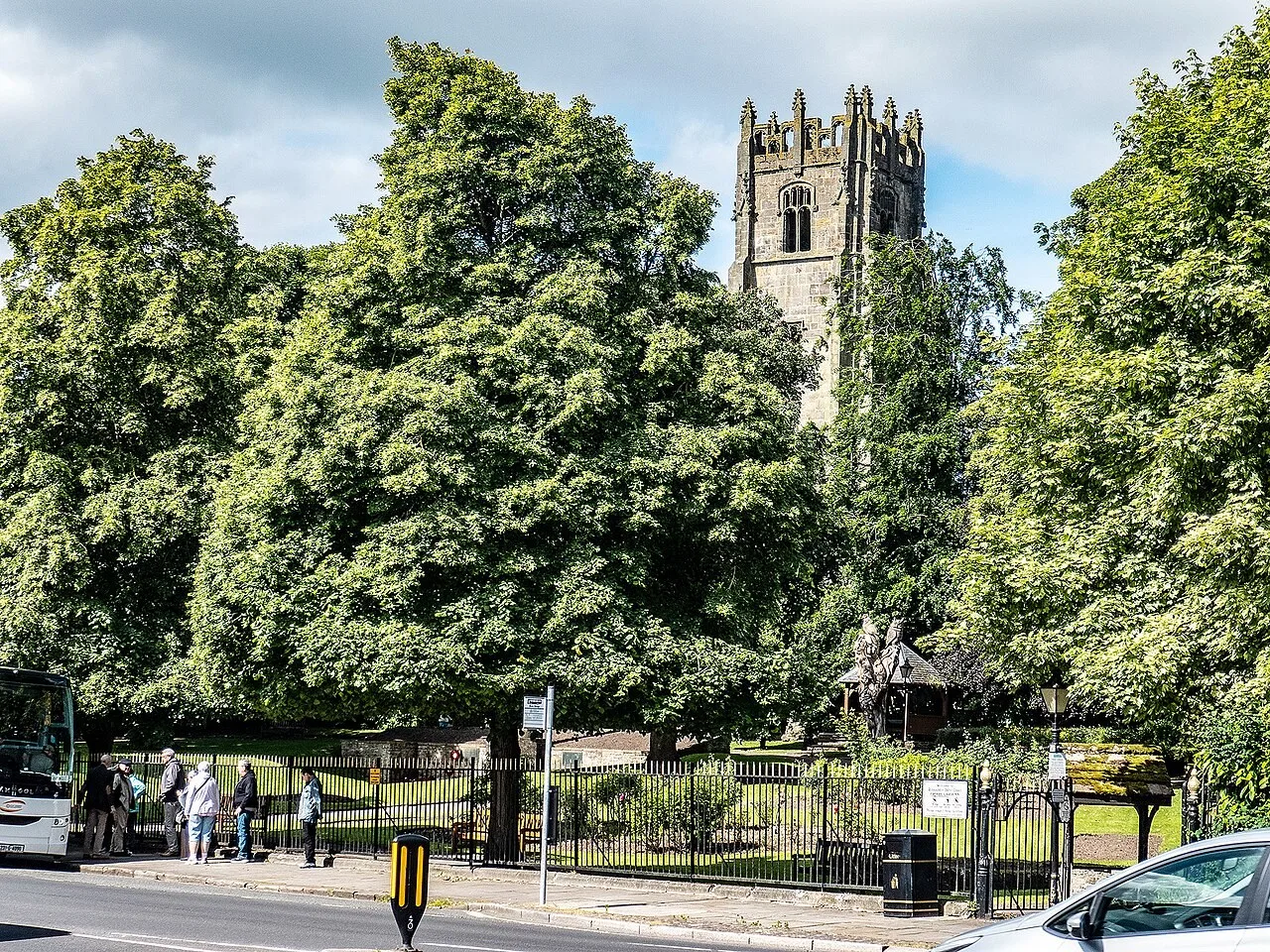 Trees, garden paths and the surviving Greyfriars tower in Richmond Friary Gardens