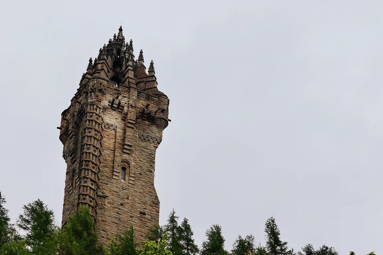 The National Wallace Monument rising above trees on Abbey Craig