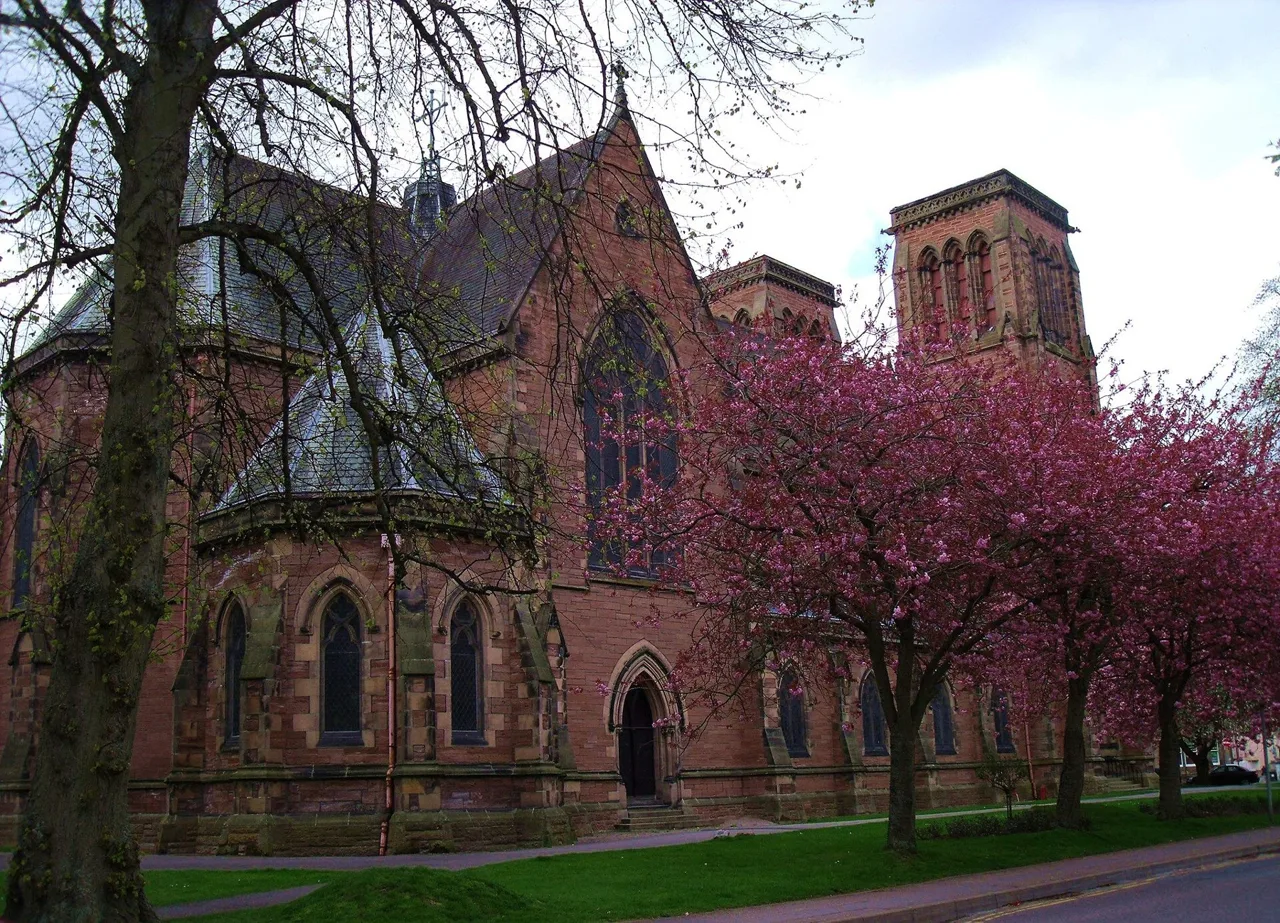 Inverness Cathedral seen through trees beside Bishop’s Road