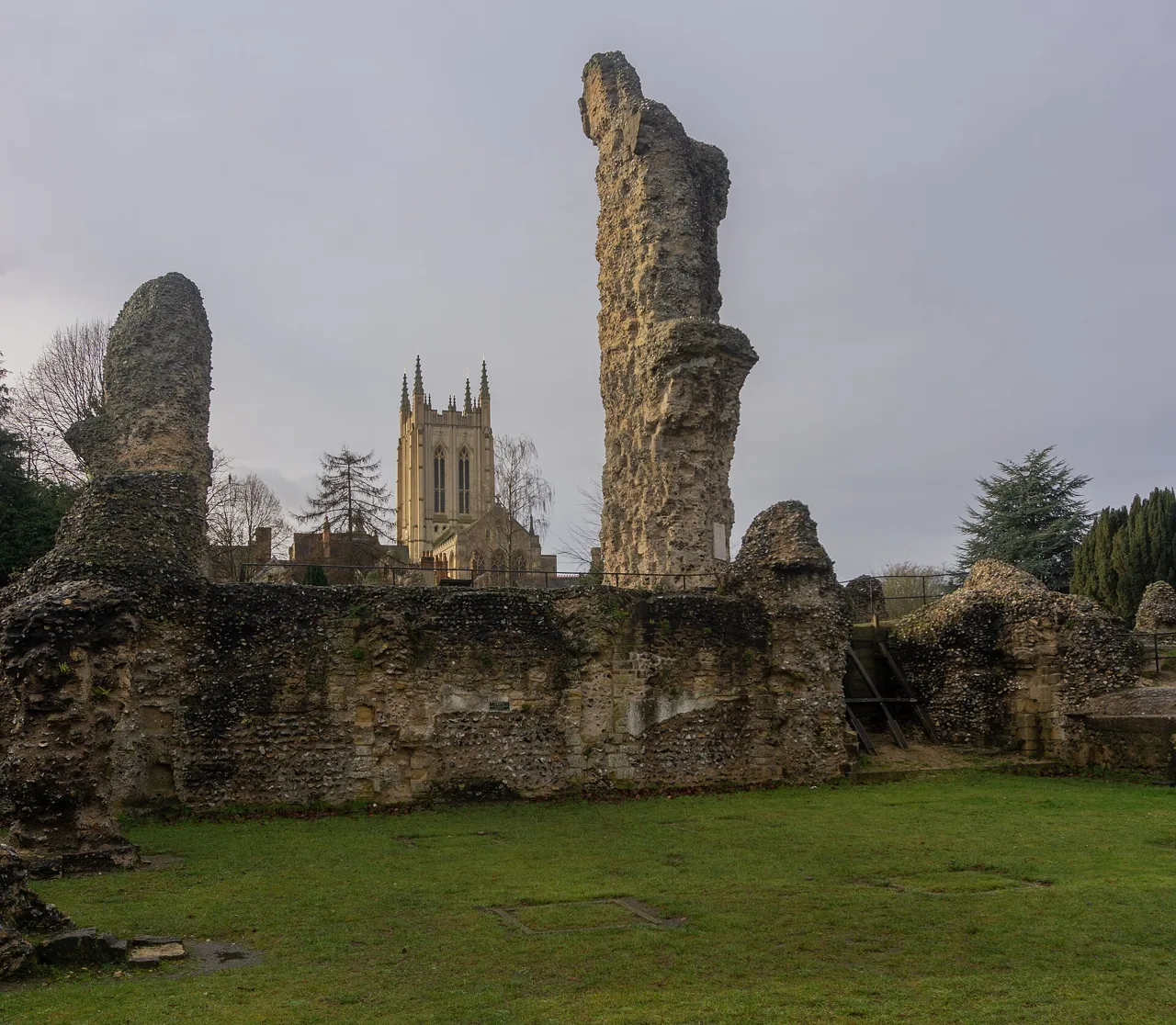 Abbey ruins in Bury St Edmunds with the cathedral tower behind