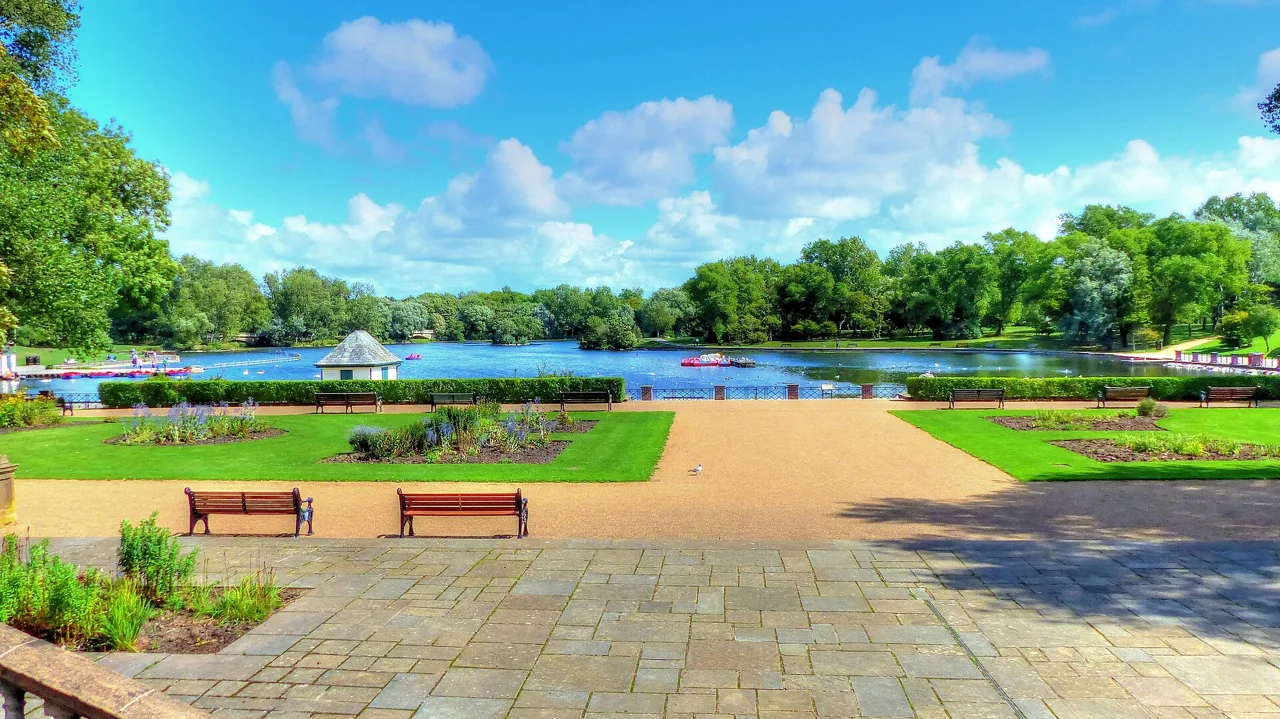 Flower beds, benches and lake in Stanley Park, Blackpool