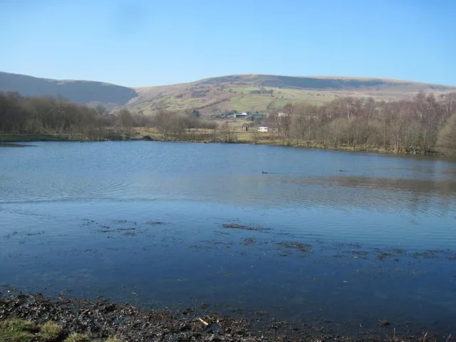 A lake and wooded slopes at Dare Valley Country Park