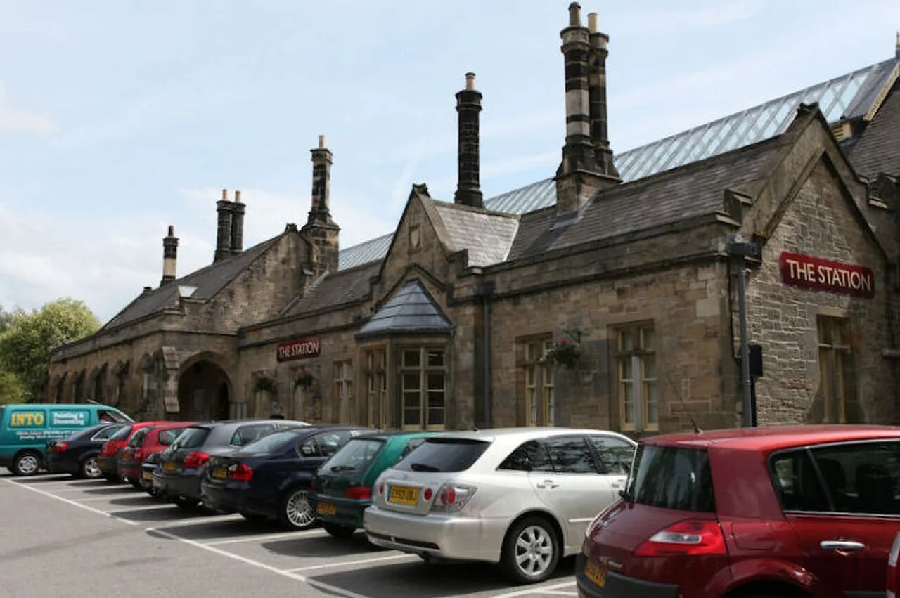 Stone former railway station building with The Station signs in Richmond, North Yorkshire
