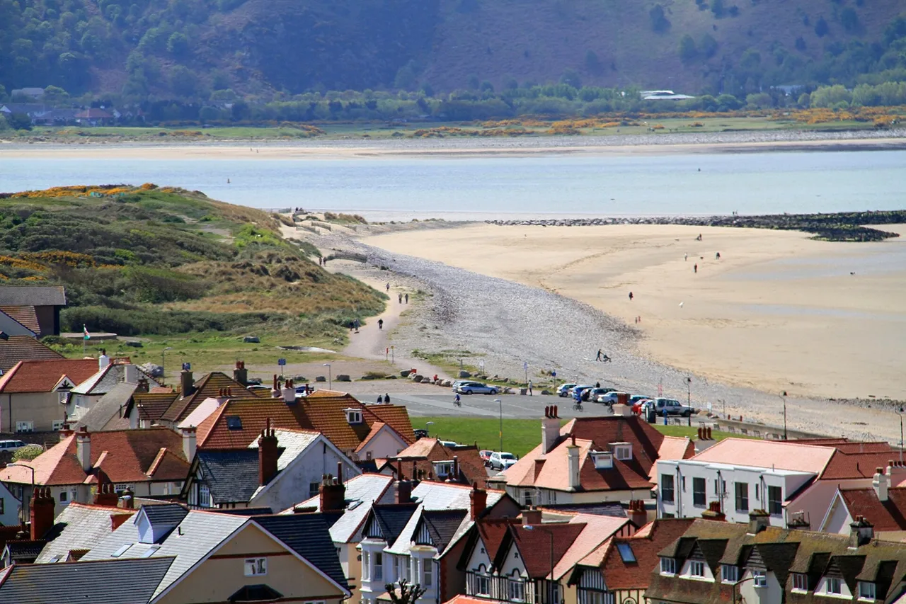 West Shore sands and the Conwy estuary seen above Llandudno rooftops
