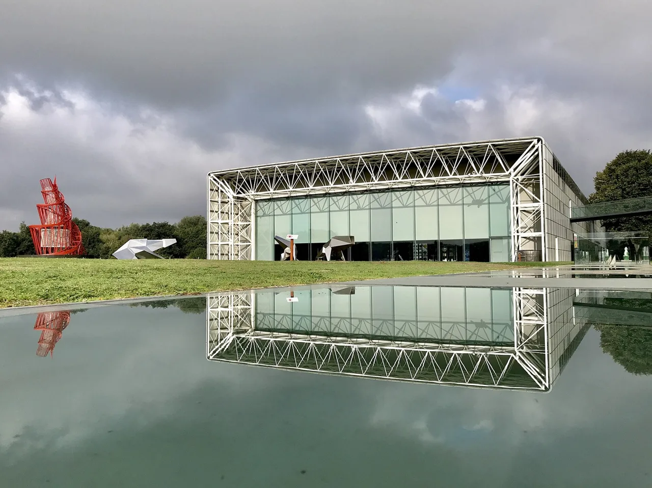 The glazed Sainsbury Centre building and outdoor sculpture at UEA
