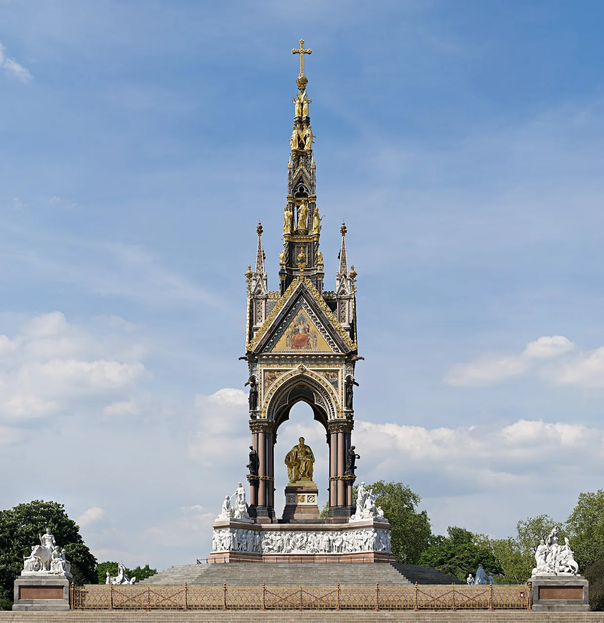 The gilded Albert Memorial rising above its sculpted stone base in Kensington Gardens