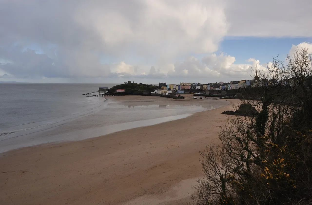 North Beach with the harbour and town beneath a cloudy sky