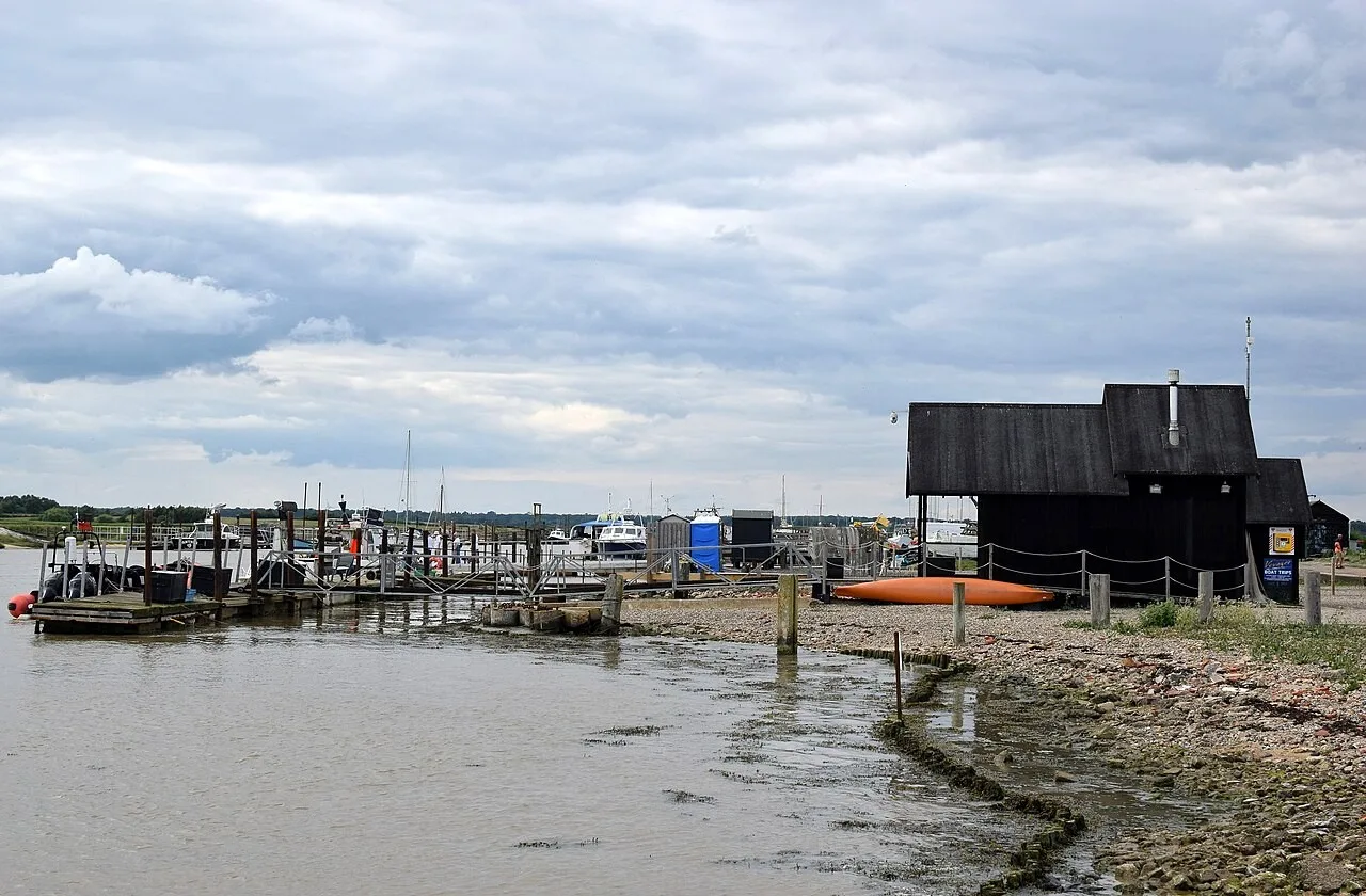 Boats, jetties and black timber buildings at Southwold Harbour