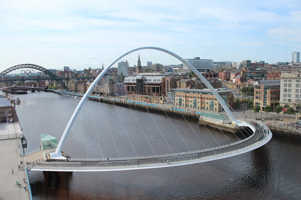 The curved Gateshead Millennium Bridge spanning the Tyne beside Newcastle Quayside