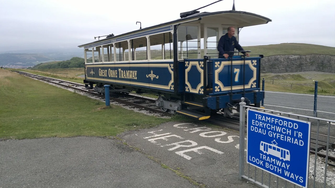 Blue Great Orme Tramway car number seven approaching the summit station