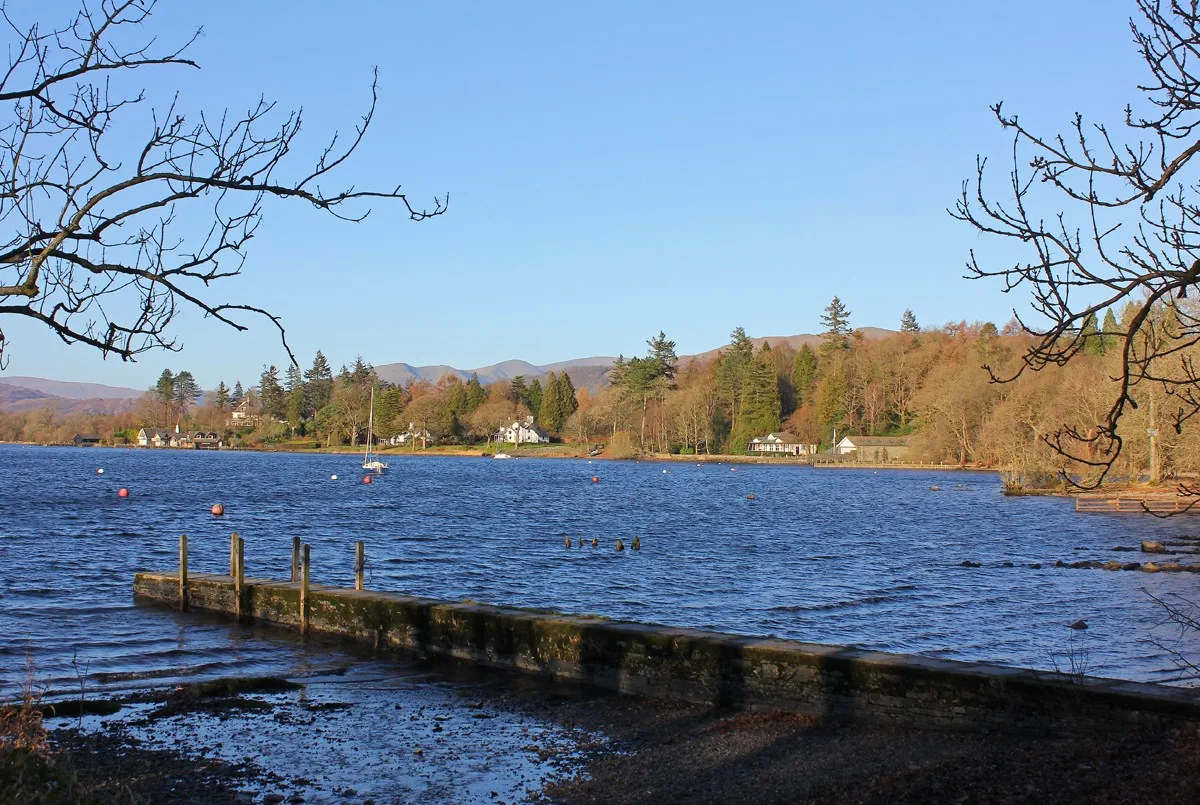 View across Windermere from the landing at Millerground, framed by bare branches