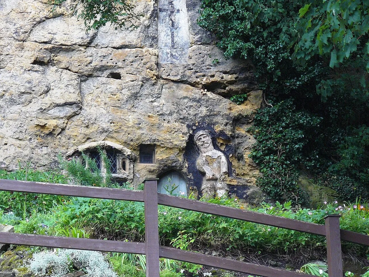 Rock-cut doorway and carved figure at the Chapel of Our Lady of the Crag