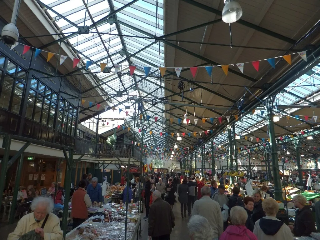 Food and produce stalls beneath the glazed roof of St George’s Market