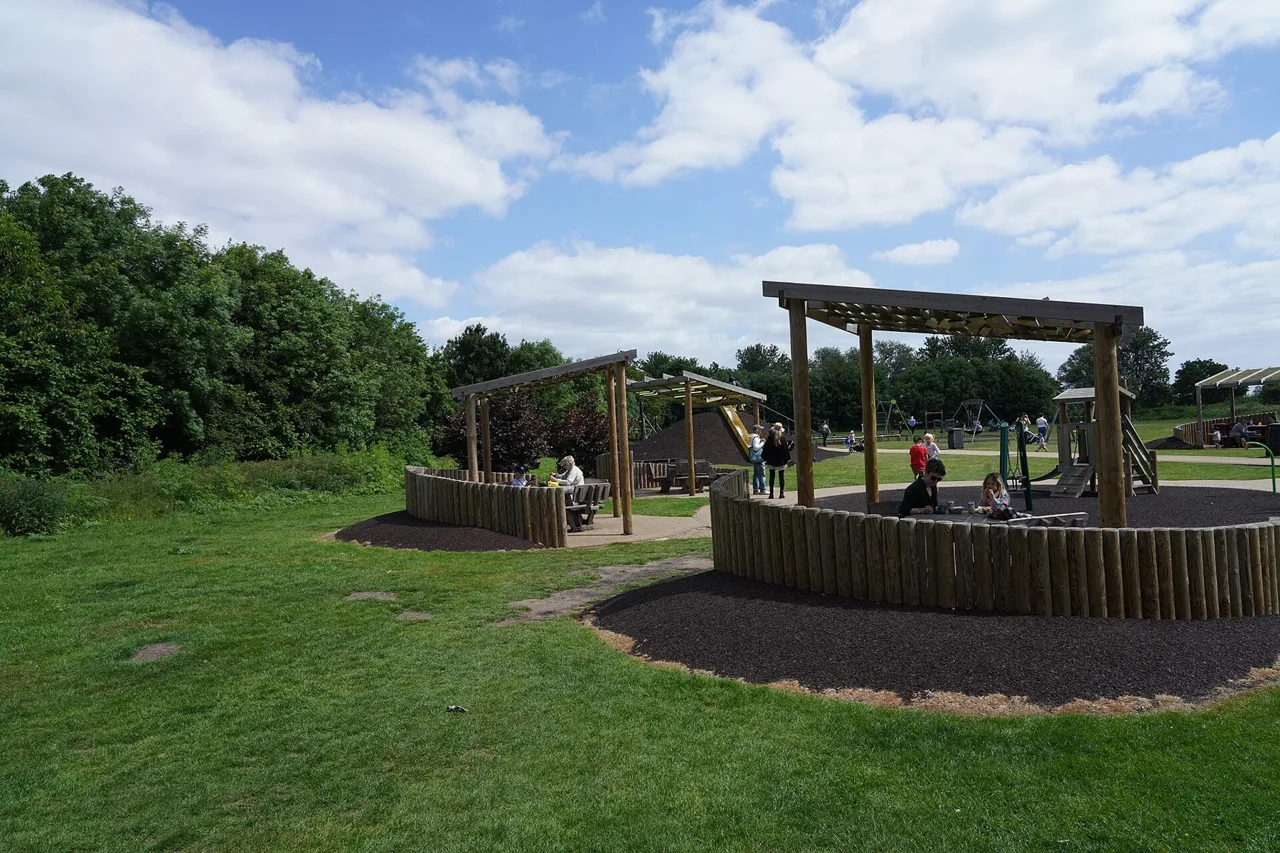 Play structures and open grass at Ely Country Park