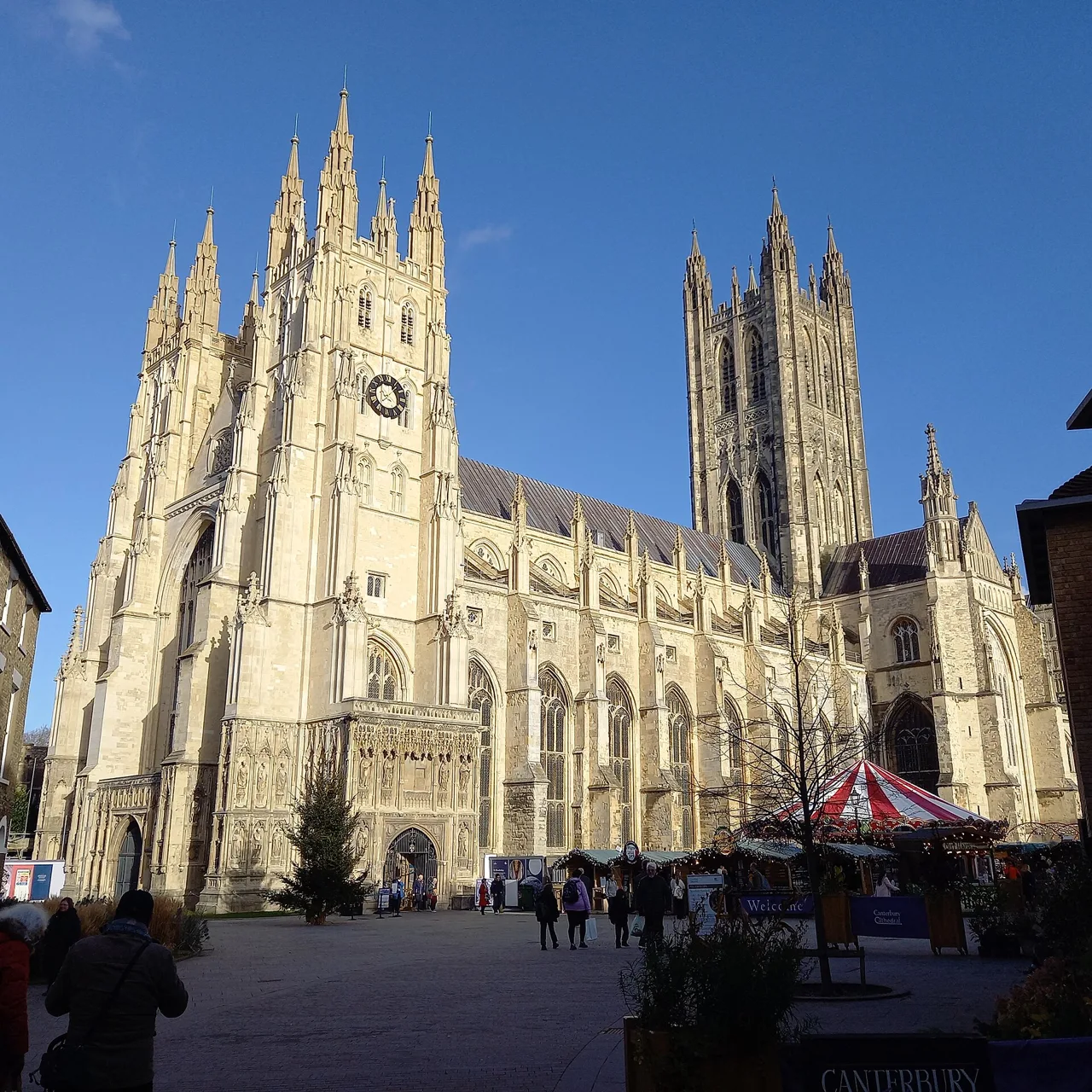 Canterbury Cathedral’s west front and Bell Harry Tower under a clear sky