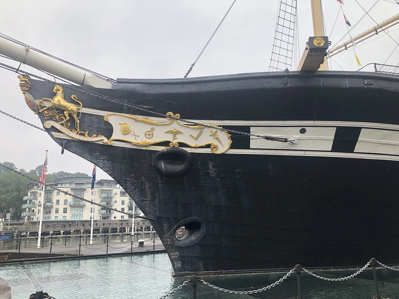 The decorated bow of SS Great Britain above its dry dock in Bristol