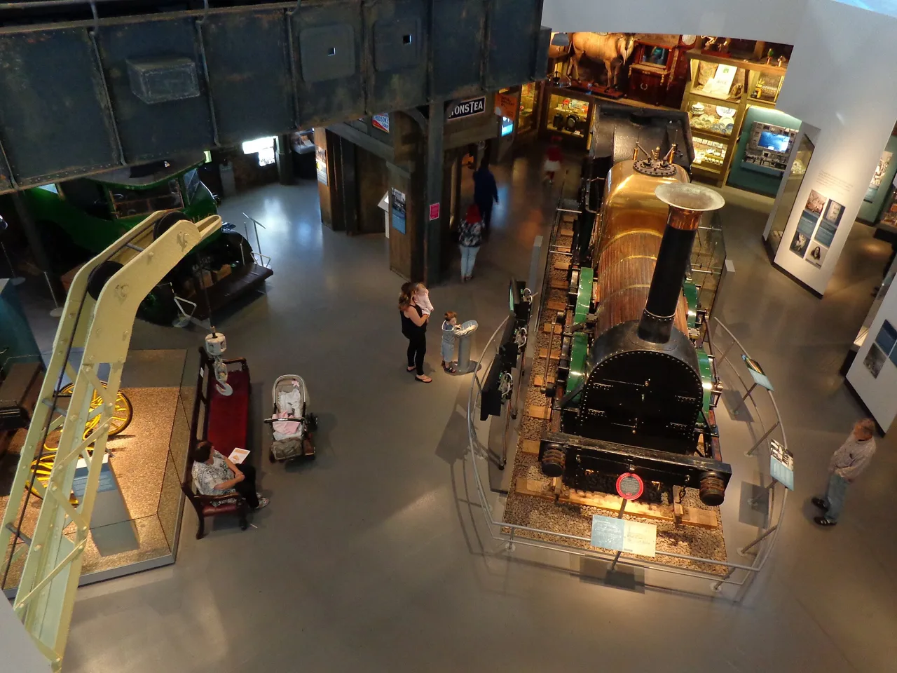 A historic locomotive and transport displays inside the Museum of Liverpool