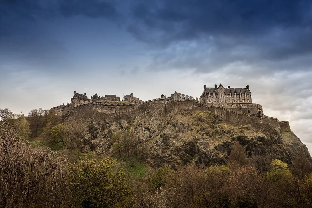 Edinburgh Castle and its stone defences above the rocky hillside