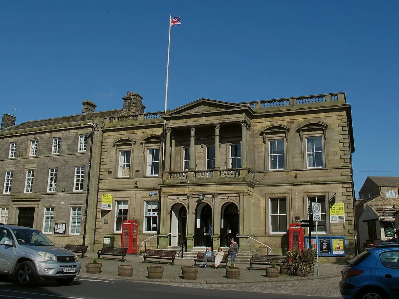 Stone facade and columned entrance of Skipton Town Hall, home of Craven Museum