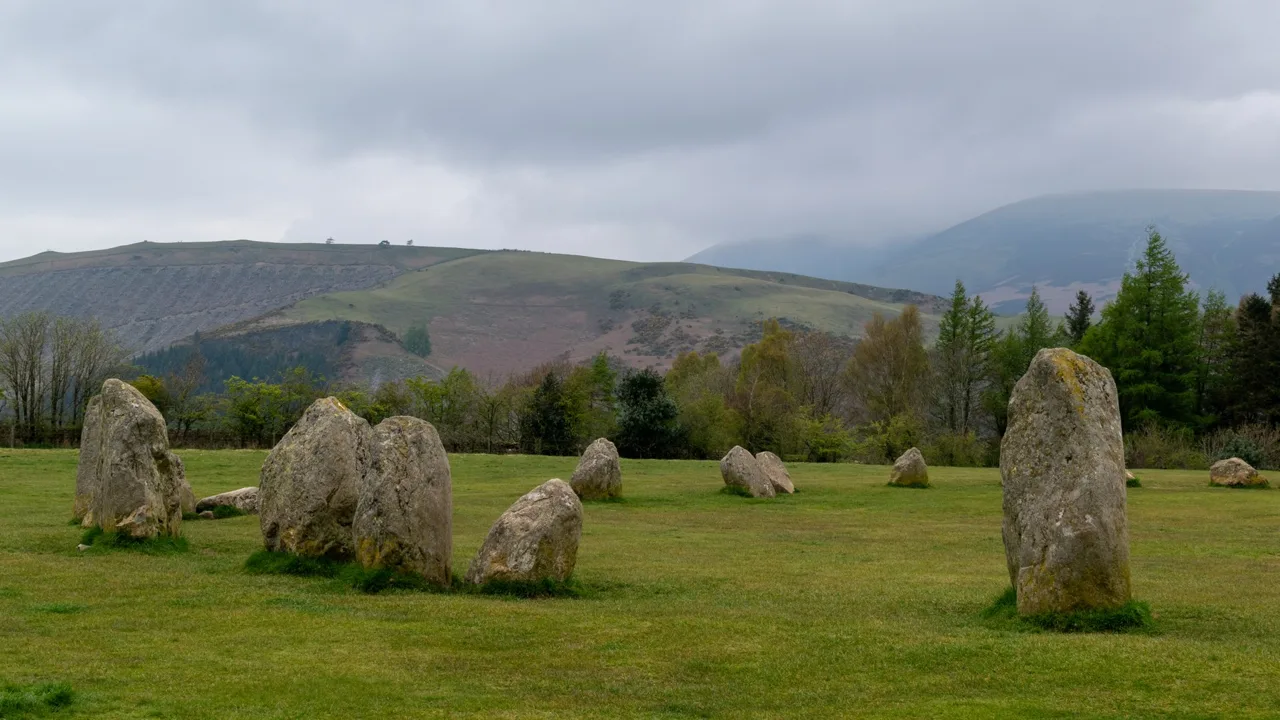 Standing stones at Castlerigg beneath an overcast fell skyline