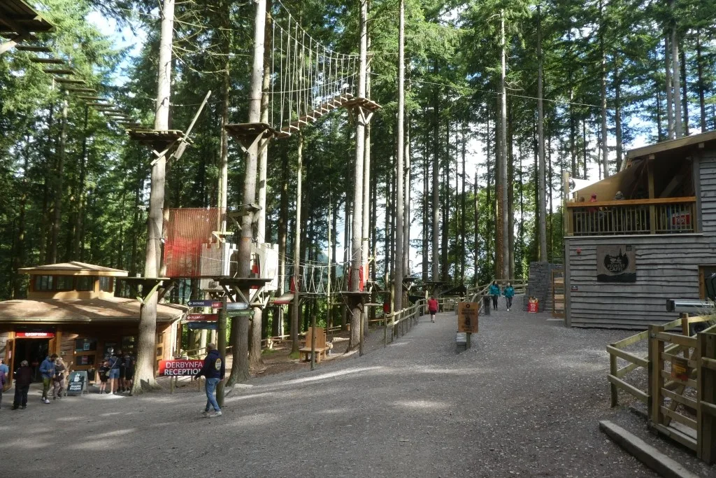 Treetop adventure structures and visitor paths at Zip World’s forest site