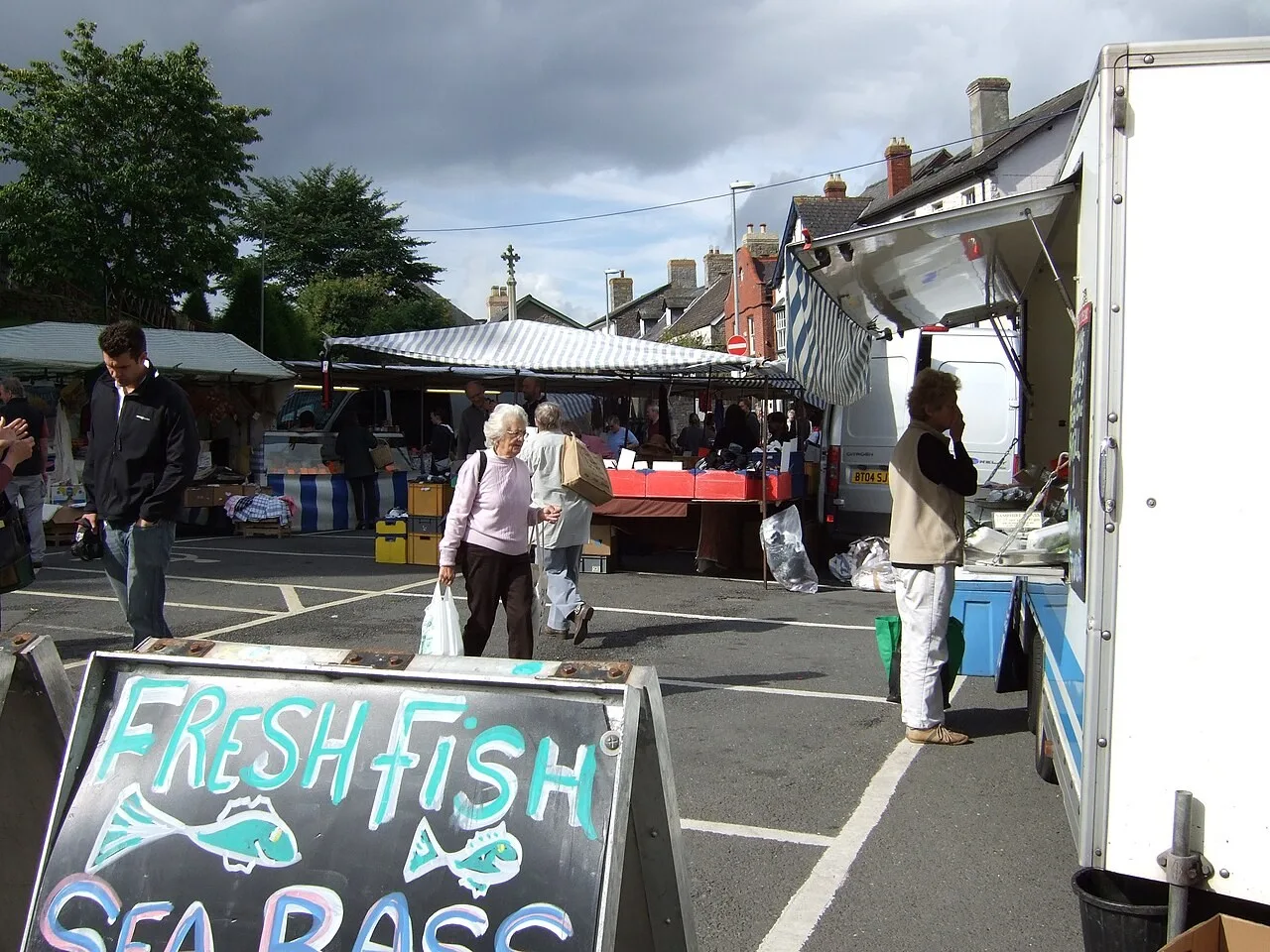 Market stalls and visitors in Hay-on-Wye