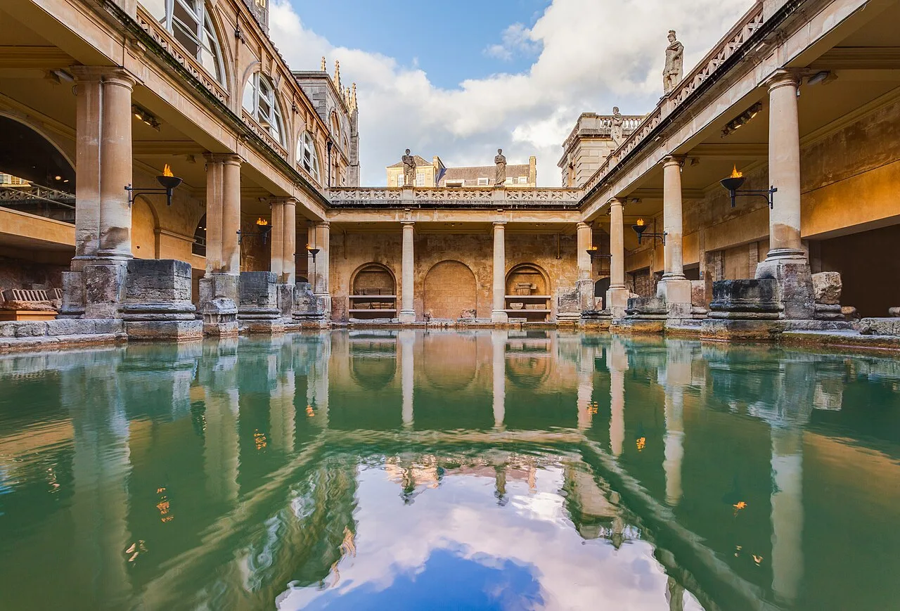 The Great Bath and its stone colonnades reflected in the water