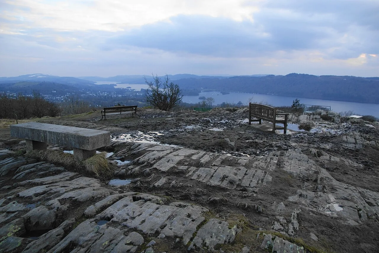 Winter lake view from Orrest Head with rocky foreground and benches, photographed in March 2013