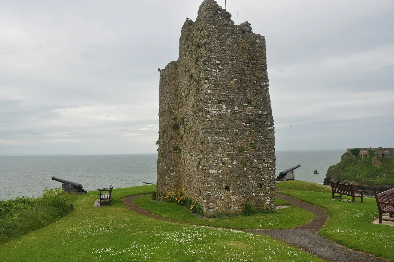 The surviving stone tower on Castle Hill above the sea