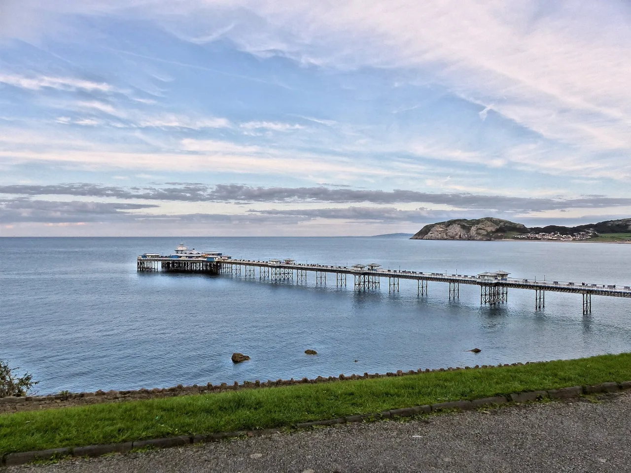 Llandudno Pier stretching across the bay with the Little Orme beyond