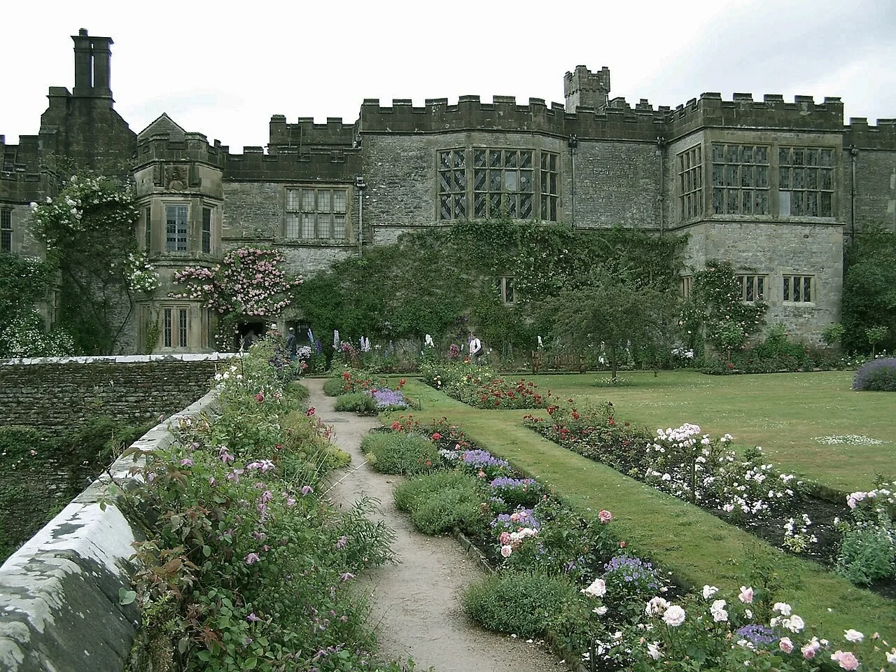 Haddon Hall’s stone facade above the planted terrace and garden paths