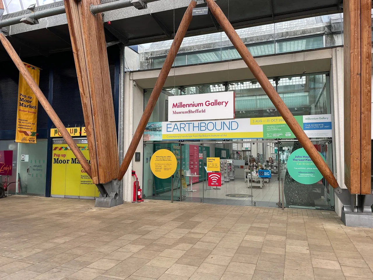 Millennium Gallery entrance beside the Winter Garden, with a past exhibition banner