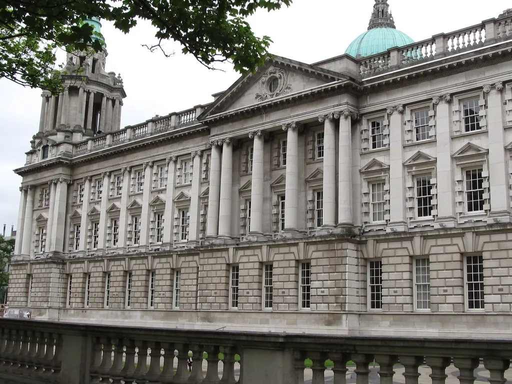 Stone columns and green domes on the western facade of Belfast City Hall