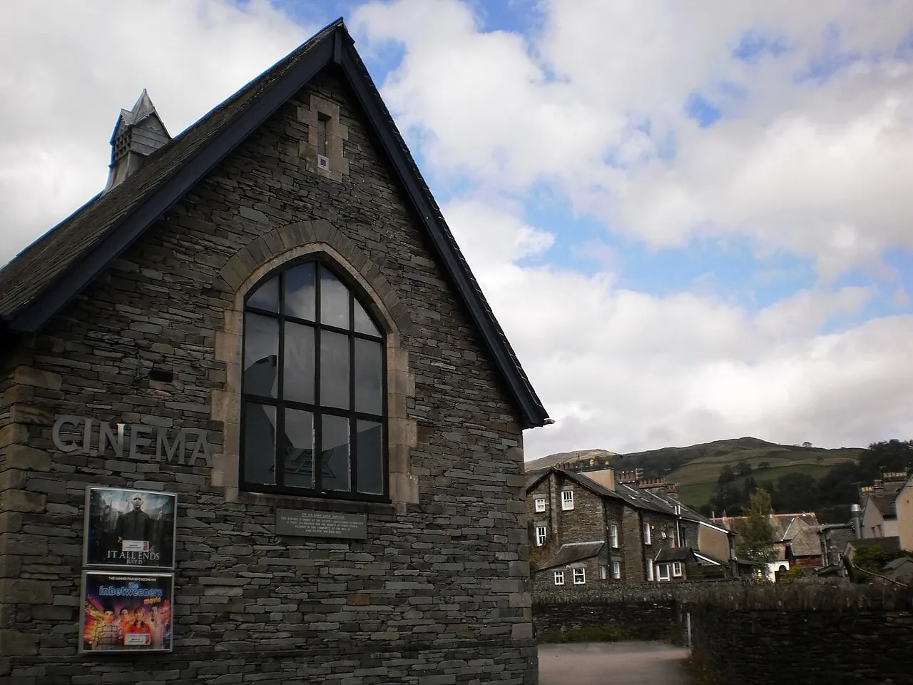 Stone exterior of Zeffirellis park-side cinema with a tall arched window