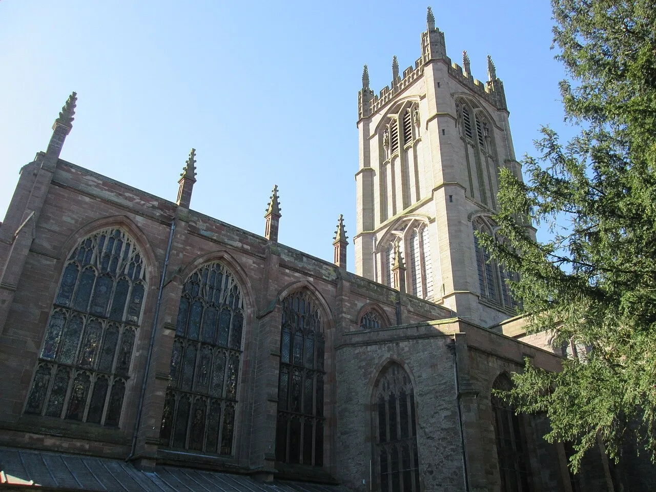 Stone tracery and tower of St Laurence’s Church in Ludlow